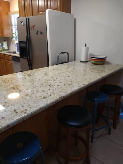 long kitchen island with seating.  Extra folding table to accommodate all guest.  