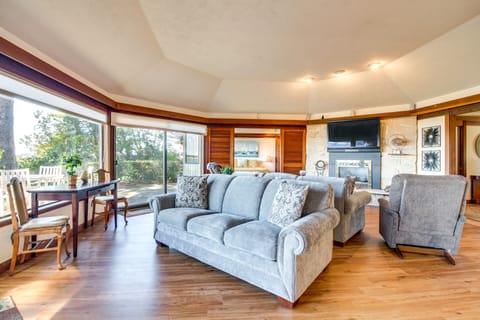 Living Room | Tree-Lined Bay Views | Gas Fireplace