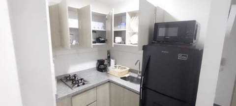 Fridge, microwave, stovetop, coffee/tea maker