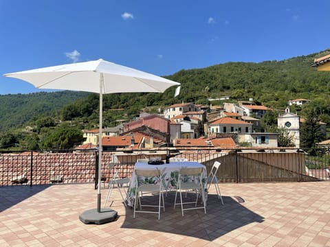 Sky, Property, Cloud, Building, Tree, Table, Outdoor Furniture, Shade, Chair, Urban Design