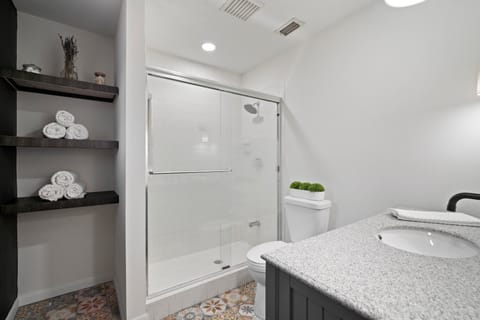 Combined shower/tub, hair dryer, towels, soap