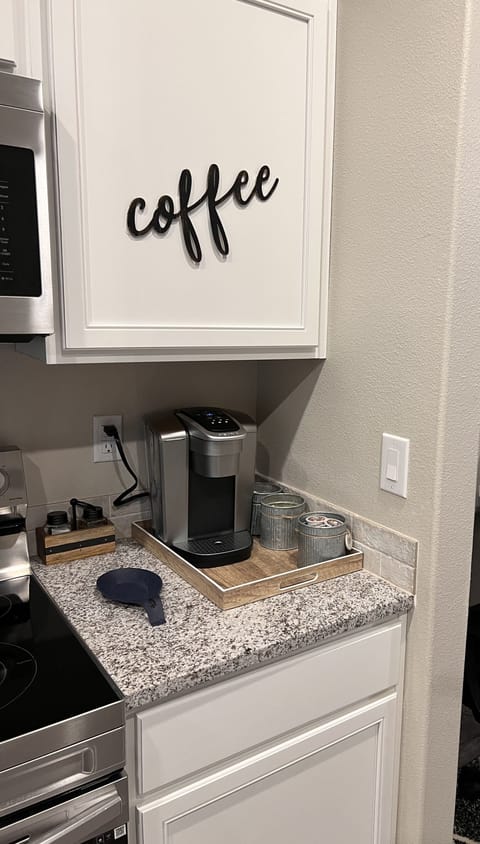 Coffee bar w/Kuerig and drip maker. 5 K-cups provided, creams, sugars, 