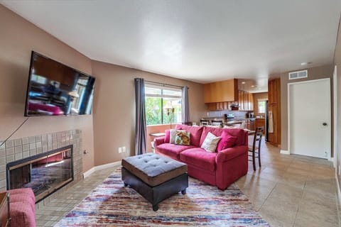 Living space continues to dining area and kitchen. Pictured, storage closet containing accessories.
