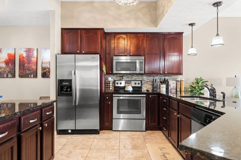Spacious, well-lit kitchen with plenty of prep space for cooking and gathering
