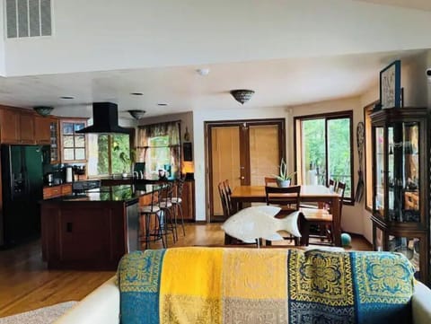 Kitchen has big windows with a beautiful view to the water.