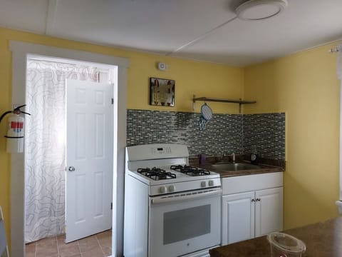 The stove and sink are part of the full kitchen in the Cottage.