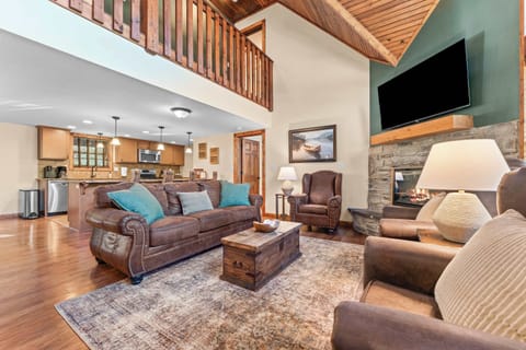 The main living area is spacious and open, ideal for your large group!