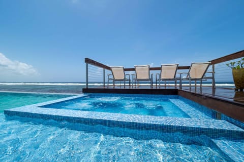 An infinity pool, sun loungers