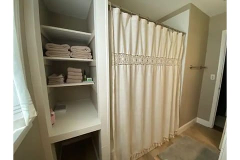 Combined shower/tub, hair dryer, towels, soap