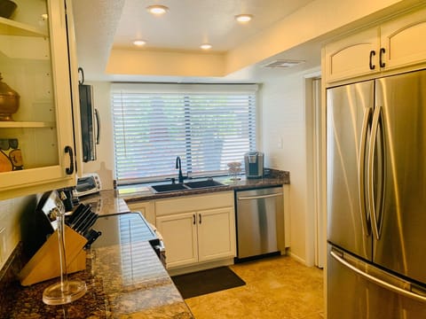 Kitchen view 3, window opens to private back patio with BBQ grill (photos soon!)