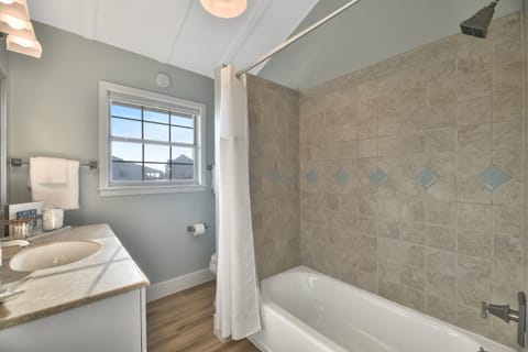 Combined shower/tub, hair dryer, towels, soap