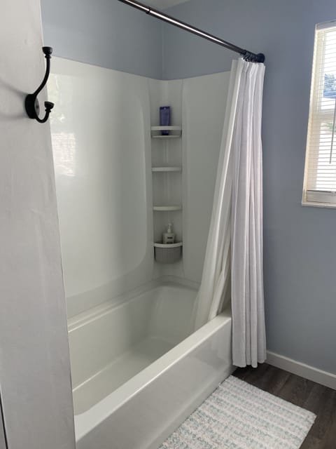 Combined shower/tub, hair dryer, towels, soap