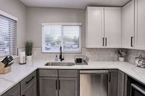 The bright kitchen has 2 large windows