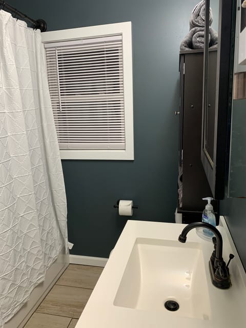 Combined shower/tub, hair dryer, towels, soap