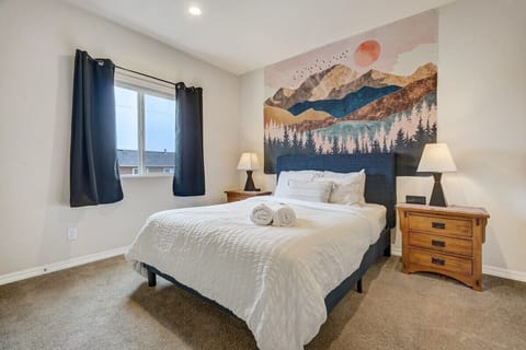 Upstairs Queen Bedroom- Our bedrooms are spacious, comfortable, and come with fresh linens, fluffy pillows, and closets for unpacking!