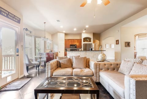 Living room with bar area (barstools not pictured) atop sturdy concrete floors.