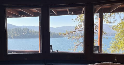 Lake view to wake up to in the master bedroom downstairs in main cabin.