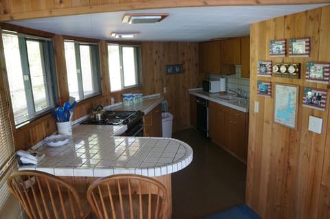 Well-equipped kitchen. Back-up frig & freezer near lawn.