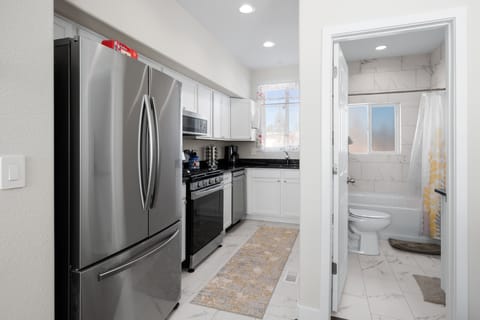 Family size refrigerator with full bath that connects to bedroom on second floor