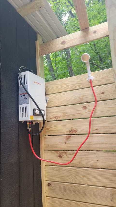 Our seasonal outdoor shower! Backup 5 gallon solar shower bag provided in winter