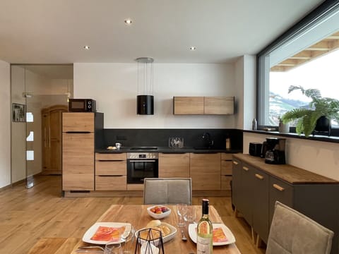 Countertop, Cabinetry, Property, Kitchen, Wood, Kitchen Stove, Interior Design, Home Appliance, Flooring, Floor