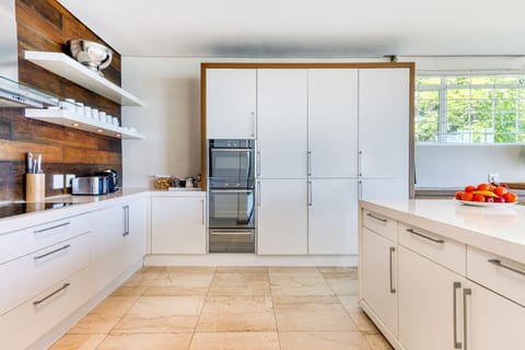 13. Full kitchen area with wine cooler