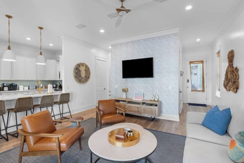 Transition seamlessly to the kitchen/dining areas.