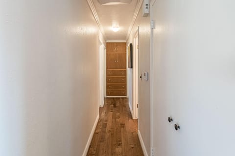 Hallway to bedrooms and common bathroom