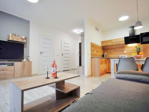 Furniture, Table, Cabinetry, Wood, Houseplant, Orange, Lighting, Interior Design, Countertop, Flooring