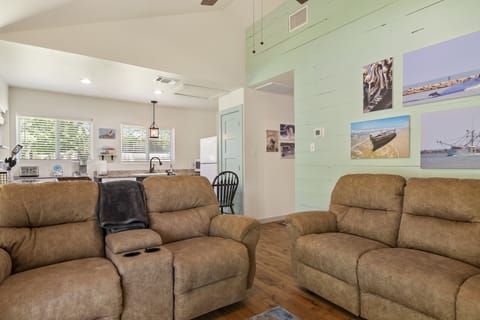 Living room complete with electric reclining lovesest and couch.