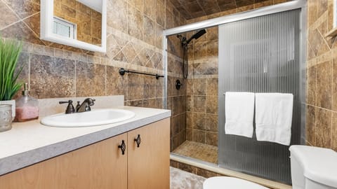 Combined shower/tub, hair dryer, towels, soap