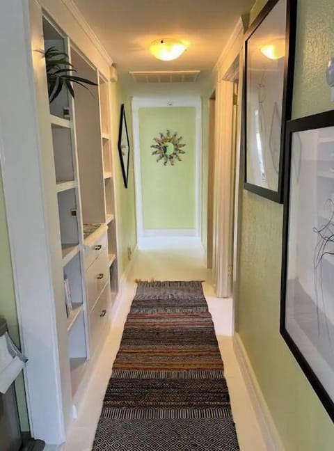 Hallway between Bedrooms 1, 2, 3 and bathroom includes a small library 