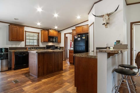 The bar-style seating is perfect for a quiet and intimate conversation, or for chatting with the cooks during meal prep.