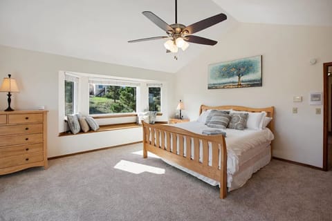 Master bedroom with King size sleep number bed with view of Garden of the Gods 