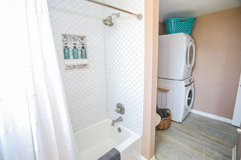 Combined shower/tub, hair dryer, towels, soap