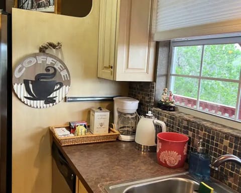 Coffee area with Coffee maker hot water hot water kettle window sink hillviews