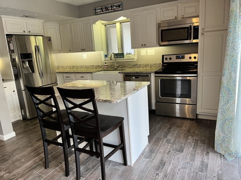 Granite countertops and tile flooring throughout the entire first floor.