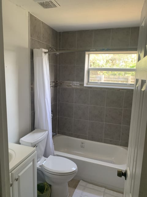 Full size bathroom with new bathtub, shower, toilet and vanity 