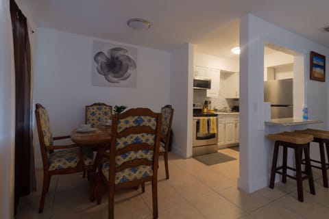 Dining area for family and friends with 4 wood chairs