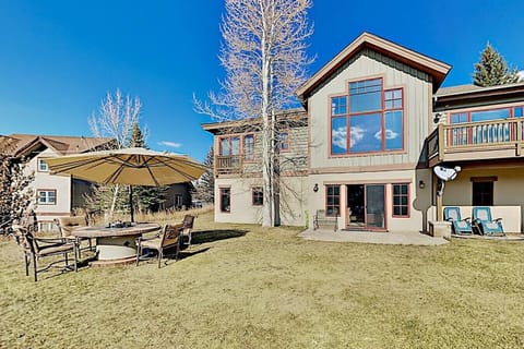 Unwind in your private backyard oasis with a hot tub, sauna, alfresco dining space, and breathtaking mountain views, surrounded by open lawn and fresh alpine air