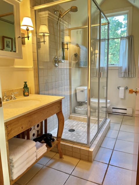 Combined shower/tub, hair dryer, towels, soap