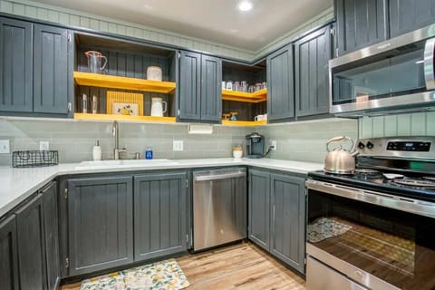 Clean, functional kitchen—perfect for making coffee, snacks, or a full meal.