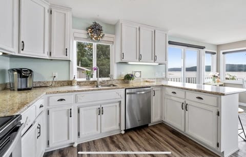 Bright and spacious kitchen with many amenities.