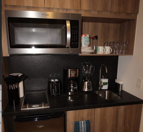 Fridge, microwave, stovetop, coffee/tea maker