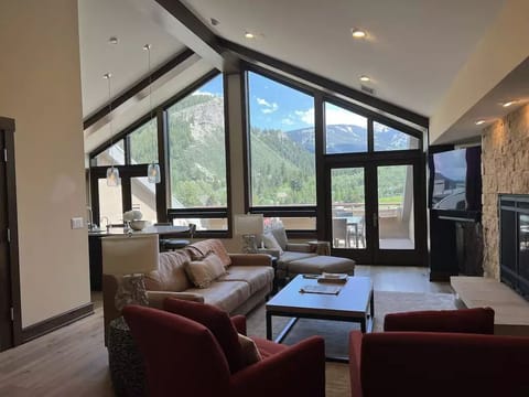 Main living room with breathtaking views of Beaver Creek and the Eagle River. 