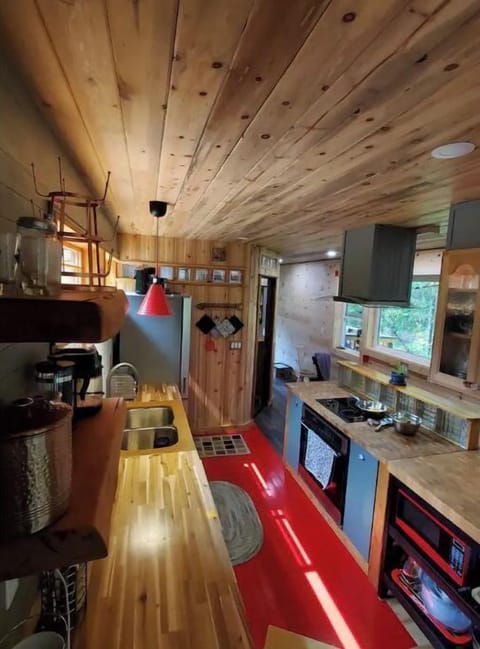 Concrete surrounding kitchen sink, angled slightly in to keep your shirt dry