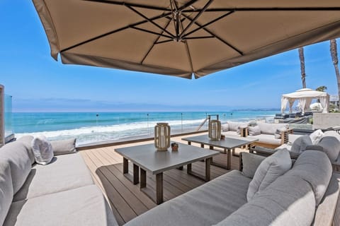 Watch the waves come right to the glass at high tide and see dolphins and more