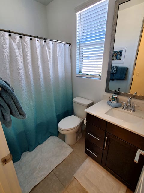 Combined shower/tub, hair dryer, towels, soap