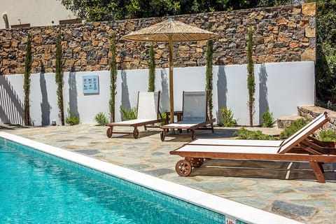 Outdoor pool, a heated pool, sun loungers