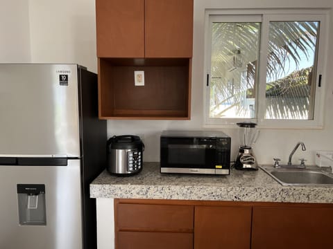 Fridge, microwave, stovetop, coffee/tea maker